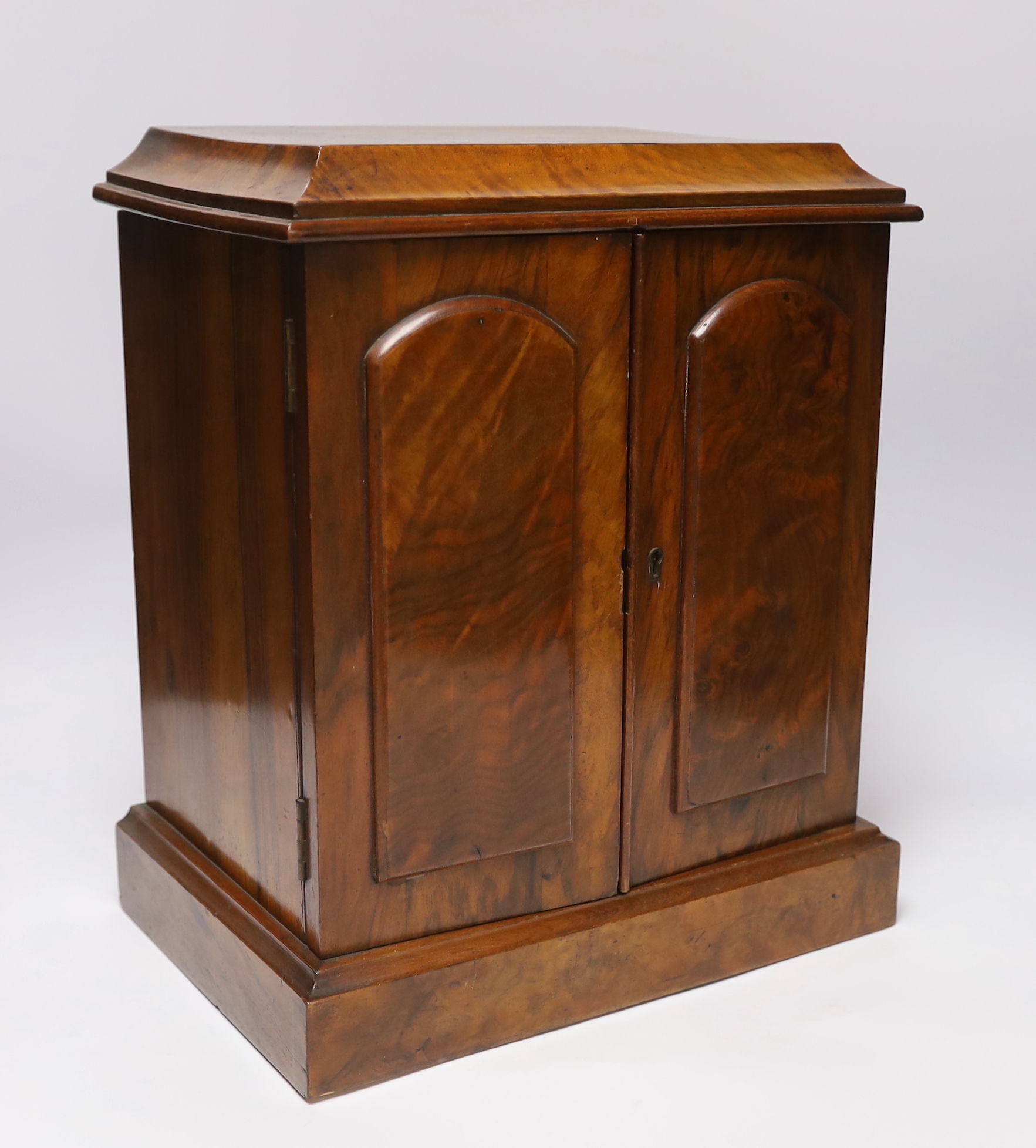 A small Victorian three drawer walnut cabinet, together with a mahogany tea caddy, cabinet 35.5cm x 30cm wide